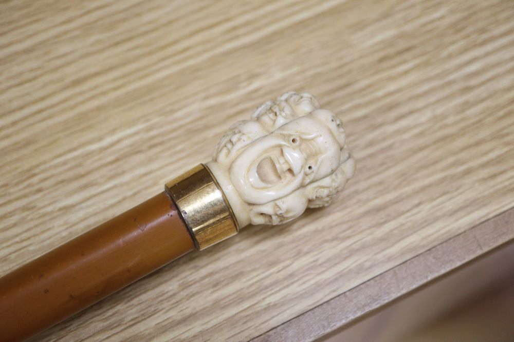 An umbrella with a carved Chinese ivory handle, c.1900, length 73cm